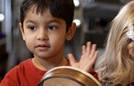 Child playing tambourine