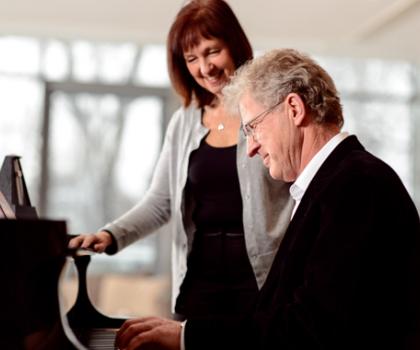 Adult playing piano