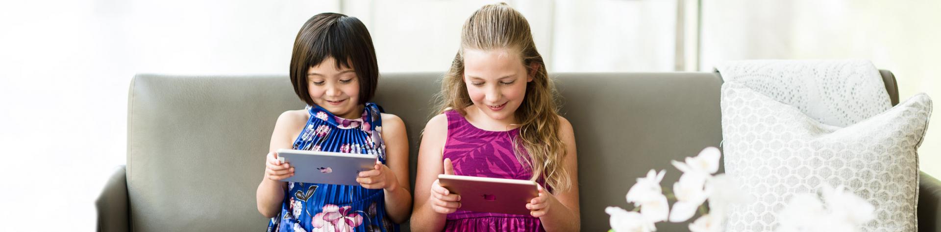 Two children learning music on a tablet