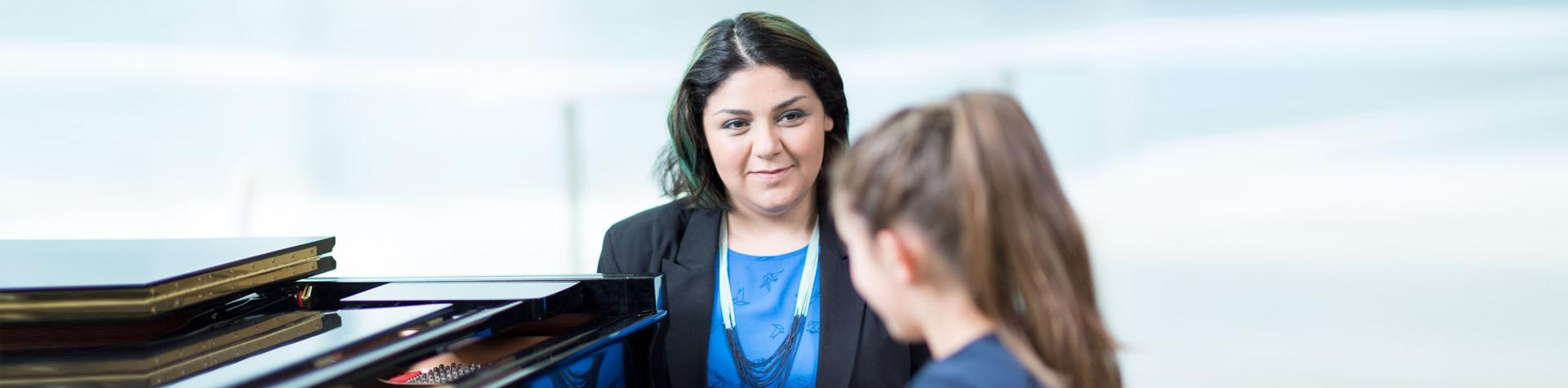 Teacher Training and Pedagogy - piano teacher and student